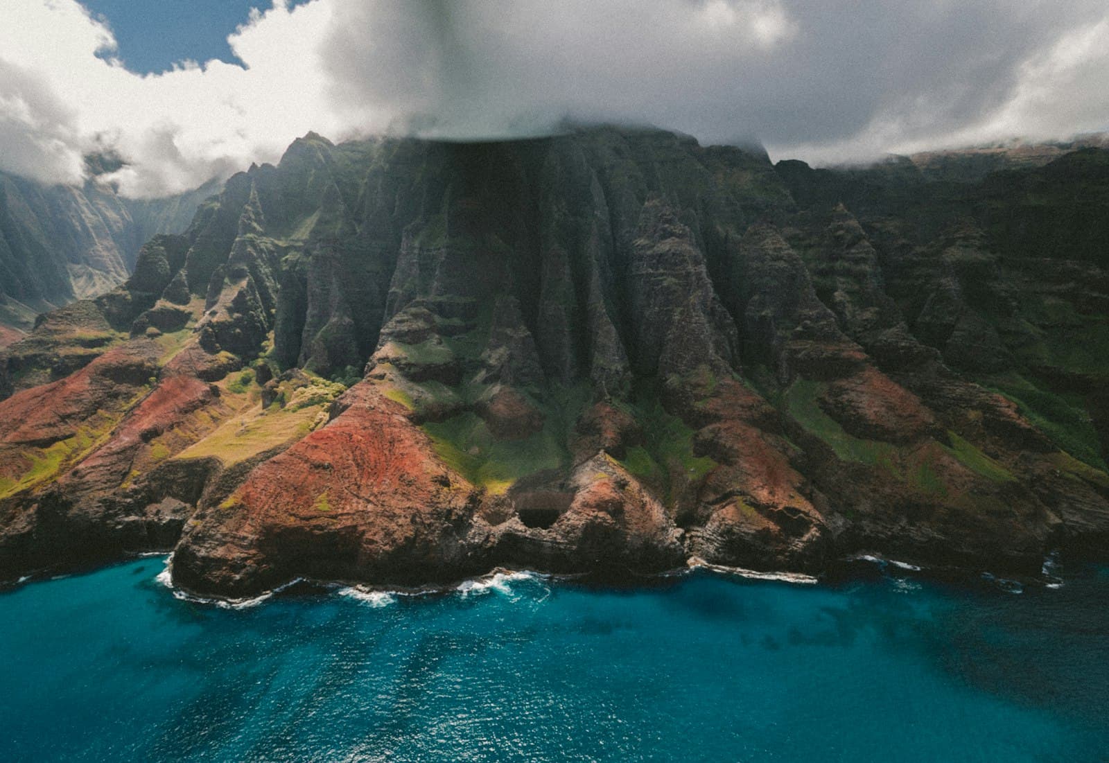 Dramatic green sea cliffs on the Na Pali Coast of Kauai