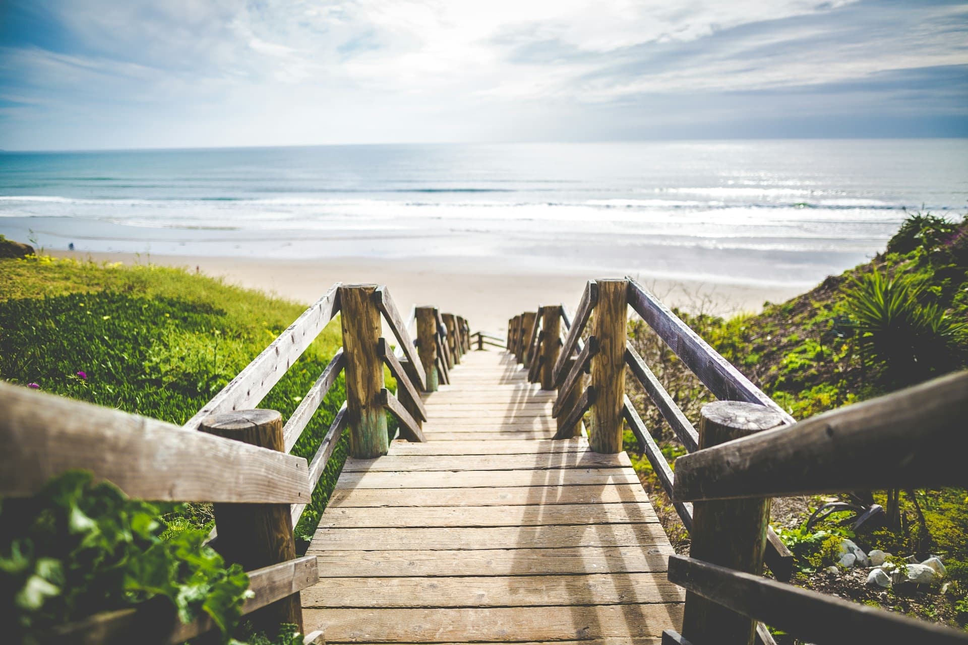 A smooth paved overlook above a calm Oregon Coast beach
