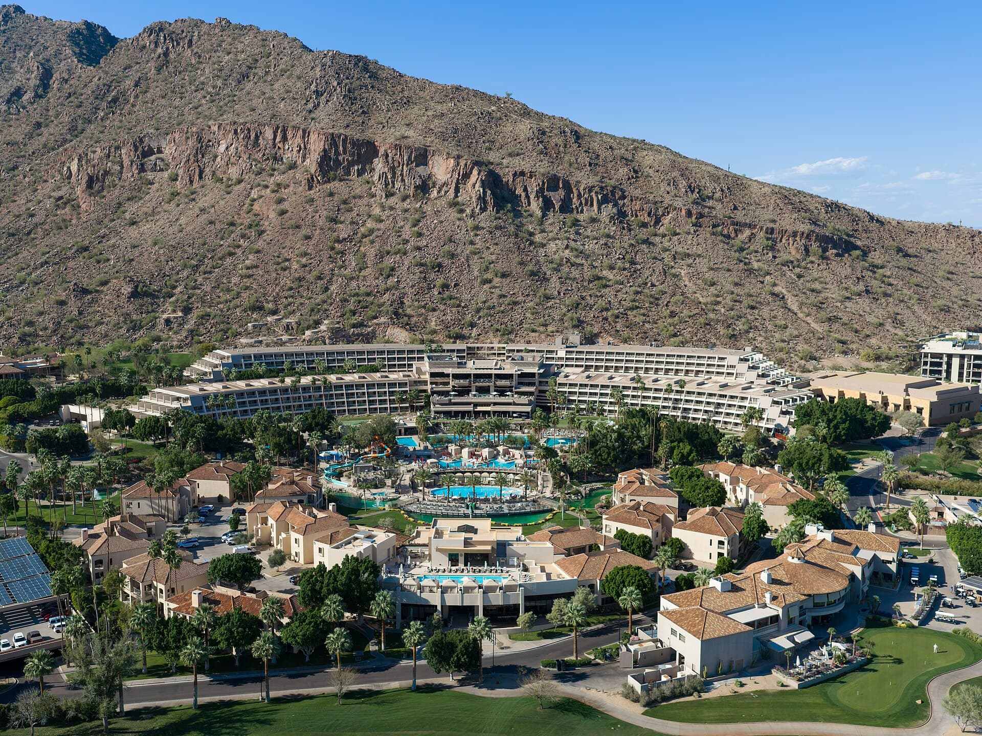 A grand desert resort courtyard at dusk