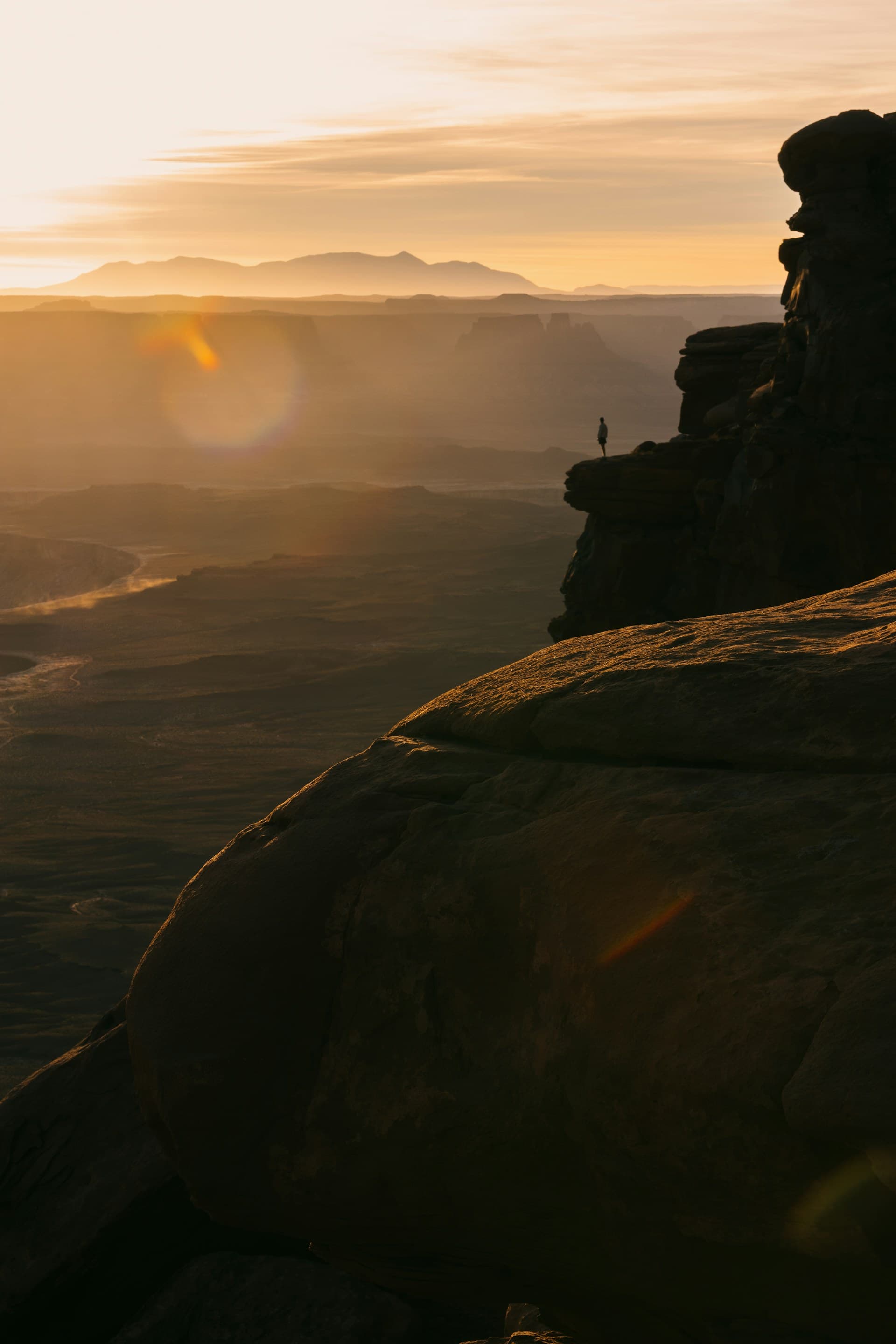 A hiker on a red-rock ridge above Sedona